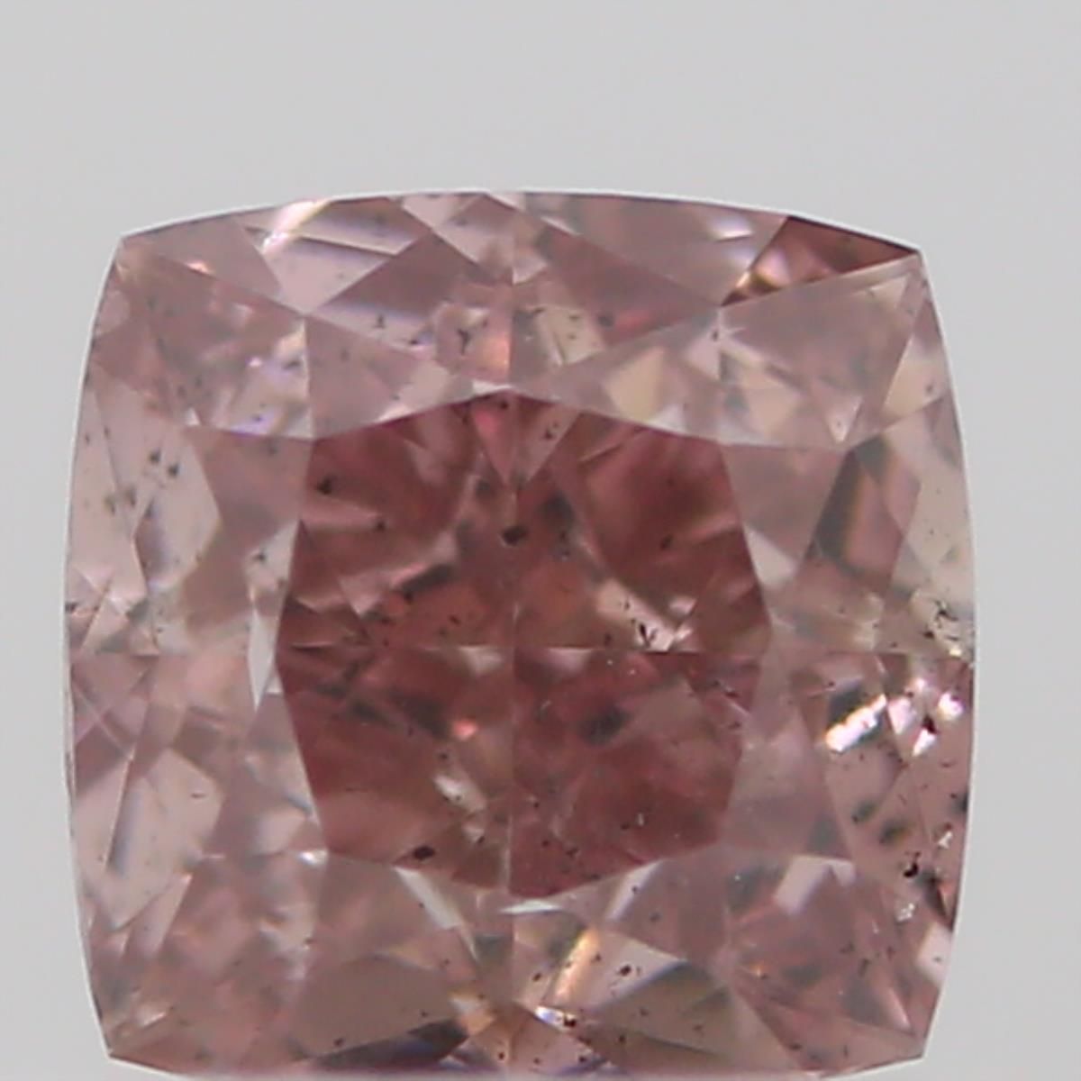 0.23 Carat Cushion brilliant Diamond Fancy Orangey Pink SI2