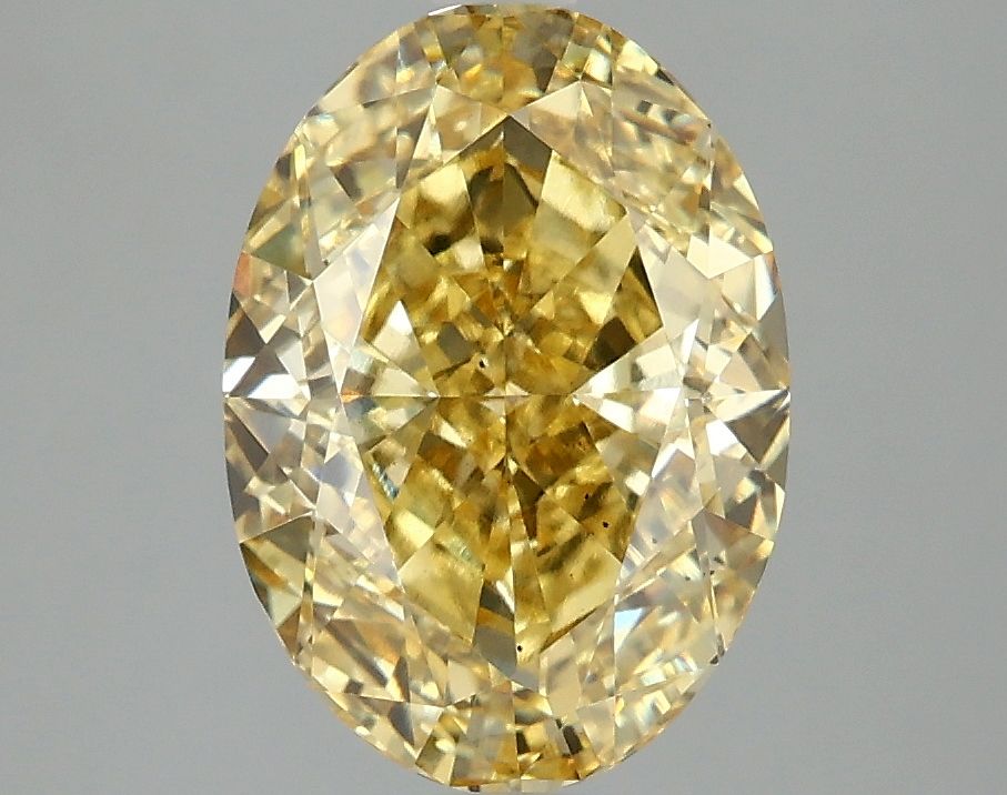 3.09 carat fancy vivid yellow VS2 EX Cut IGI oval diamond